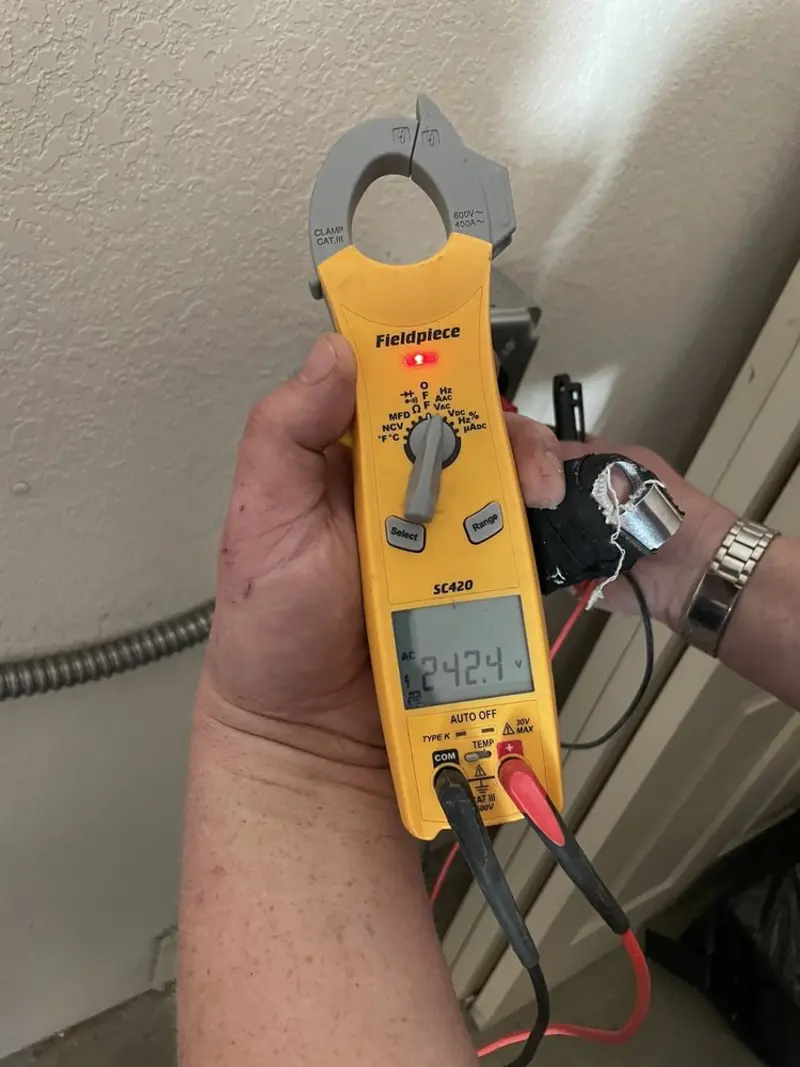 Voltage testing with clamp meter during Whole House Surge Protector in Oak Grove